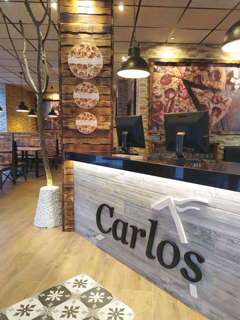 Pizzerías Carlos inaugura su primer restaurante en Barcelona capital