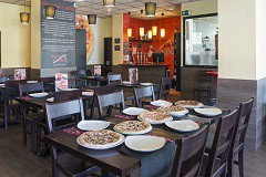 Pizzerías Carlos inaugura su local en El Prat